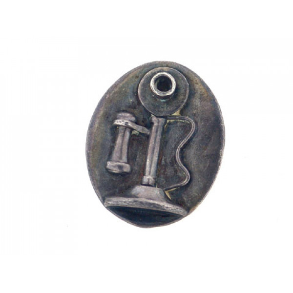 Brooch from silver with embossed representation of old telephone. 