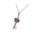 Platinum Plated Silver Key Pendant adorned with Rubellite