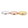 Three rings with platinum, yellow and pink gold plating with white sapphires