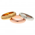 Three rings with platinum, yellow and pink gold plating with white sapphires