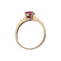 14K Gold Solitaire Ring adorned with a Ruby accented with Diamonds