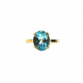 14K Gold Coctail Ring adorned with a Blue Topaz