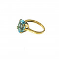 14K Gold Coctail Ring adorned with a Blue Topaz