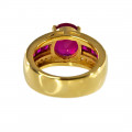 18K Gold Ring adorned with a Oval Ruby, a tow of square cut Rubies and two rows of Diamonds