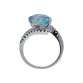 14K White Gold Ring adorned with a Blue Topaz and White Sapphires