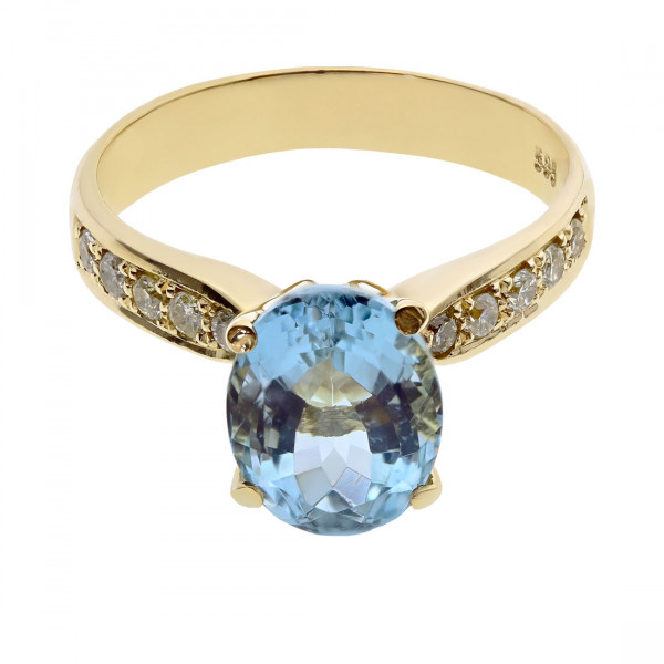 14K Gold Ring adorned with a Blue Topaz and Diamonds