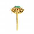 Gold Ring adorned with a Navette-cut Colombian Emerald surrounded by Diamonds
