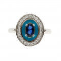 White Gold Ring adorned with a Blue Sapphire, a Diamond Halo and Turquoise Enamels