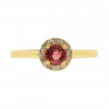 Gold Ring adorned with a red Sapphire and a Diamond Halo