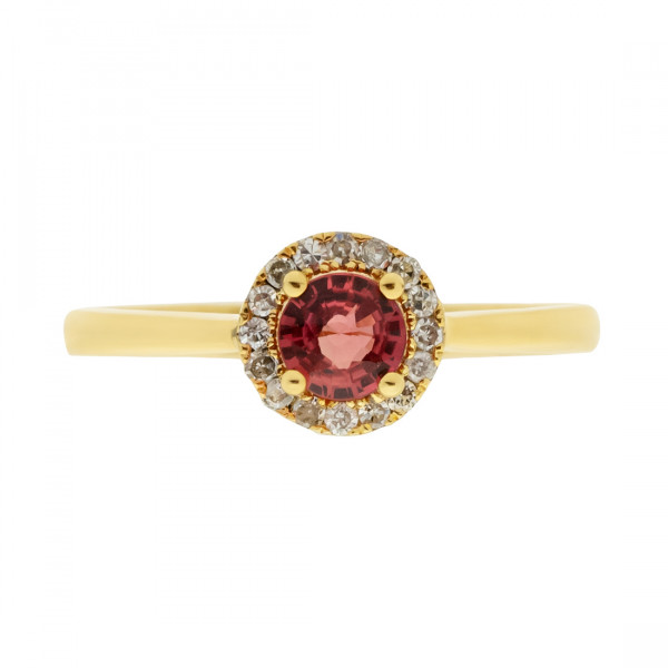 Gold Ring adorned with a red Sapphire and a Diamond Halo