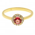 Gold Ring adorned with a red Sapphire and a Diamond Halo