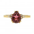 Gold Ring adorned with a Pink Sapphire and Diamonds