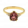 Gold Ring adorned with a Pink Sapphire and Diamonds