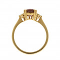 Gold Ring adorned with a Pink Sapphire and Diamonds